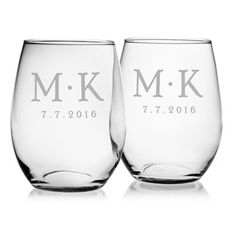 two personalized stemless wine glasses on a white background