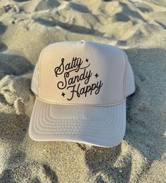 Salty Sandy Happy Women's Trucker Hat Trendy Trucker Hat Gifts for her Beach Trucker Hat River Hat Lake Life Hat Tan Trucker Hat ♥ Tan-Khaki OTTO Trucker Hat - One size fits most, Snapback mesh foam trucker hat ♥ Do not bleach or iron directly onto the design ♥ Wash on Cold - Inside out, preferable  ♥ Colors can vary from screen to screen - Please understand the actual color may vary slightly from your monitor or phone display  ♥ No refunds or exchanges since all orders are made once ordered but Summer Beige Cap, Beachy White Hat, White Beachy Hat, White Beachy Hat, One Size Fits Most, Cute Beige Hat For Vacation, Cute Beige Hats For Vacation, Trendy Letter Print Sun Hat For The Beach, Beige Curved Brim Hat With Letter Print, Trendy Sun Hat With Letter Print For Beach