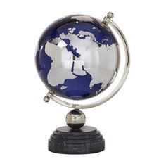 a blue and white globe on top of a wooden base with a metal ball in the middle