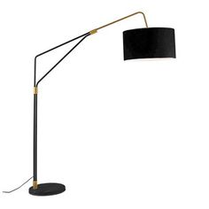 a floor lamp with a black shade on the base and a gold metal arm,