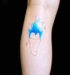 a man's leg with a blue and white tattoo design on the left side of his arm