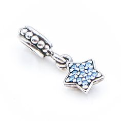 Authentic PANDORA Blue Pave Star Sterling Silver Dangle Dangle Charm With Blue Zirconia 791024CZB - Retired. This beautiful sterling silver star dangle charm will twinkle on your bracelet with its blue pavé zirconias. This item is retired from production and may be difficult to find. Charm is pre-owned and in great condition. Buy with confidence that all my Pandora items are 100% authentic Pandora. All precious metals are tested and are guaranteed with the Thermo Scientific Niton DXL Xray Scanne Blue Star Charm Jewelry, Silver Star Charm With Celestial Style, Silver Star Charm Celestial Charms, Silver Star Charm Celestial, Silver Celestial Star Charm, Pandora Blue, Dangle Charms, Silver Stars, Jewelry Pouch