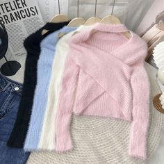 Soft Pastel Knit Sweater with Asymmetrical Neckline Fitted Soft Texture Winter Sweater, Winter Stretch Asymmetrical Sweater, Chic Winter Tops With Soft Texture, Casual Asymmetrical Knit Top For Winter, Asymmetrical Stretch Sweater For Winter, Stretch Asymmetrical Winter Sweater, Stretch Asymmetrical Sweater For Winter, Trendy Asymmetrical Sweater For Winter, Elegant Asymmetrical Sweater For Winter