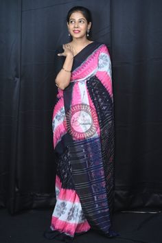 Weaver communities of Maniabandha and Nuapatana of Odisha traditionally weave this kind of saree. Common motifs are star, temple, conch, rudraksh, fish, chakra, lotus etc. The inspiration of all its designs comes from nature. It is the best of single ikat; one of warp and weft is tied and dyed prior to weaving. The borders and the pallas have tremendous variety and each one of them is attractive and praiseworthy. Specification:  Occasion: Festive Wear Fabric: Khandua Cotton Primary Color: Pink S Multicolor Bandhani Traditional Wear For Rituals, Traditional Multicolor Pre-draped Saree For Navratri, Multicolor Bandhani Print Traditional Wear For Rituals, Multicolor Blouse Piece With Woven Motifs For Festivals, Multicolor Traditional Drape Blouse Piece With Weaving Work, Multicolor Blouse Piece With Traditional Drape And Weaving Work, Multicolor Blouse Piece With Weaving Work And Traditional Drape, Festive Multicolor Blouse Piece With Woven Motifs, Multicolor Pre-draped Saree With Traditional Patterns For Transitional Season