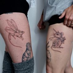 two people standing next to each other with tattoos on their legs and one has a mouse