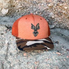 Jackalope mesh trucker cap with camo bill. Wyoming artisan designed. Printed in Wright, WY. Roam Around Wear is a Wyoming t-shirt company based out of Gillette, WY Brown Western Style Baseball Cap For Outdoor, Brown Western Snapback Hat For Outdoor, Country Style Brown Baseball Cap For Outdoor, Western Style Snapback Hat For Outdoor, Western Style Brown Trucker Hat For Outdoor, Country Style Trucker Hat With Curved Brim For Outdoor, Country Style Trucker Hat With Curved Brim, Casual Hunting Hat With Flat Brim, Casual Flat Brim Hunting Hat