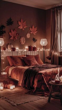 a bedroom with candles lit up on the wall and bed in the foreground,