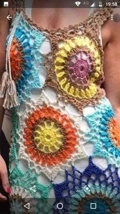 a crocheted tank top is shown with an app on the bottom and side