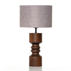 a wooden table lamp with a grey shade