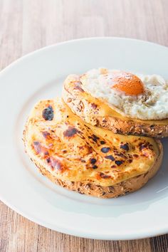 there is a plate with some food on it and the words, welsh rabebit