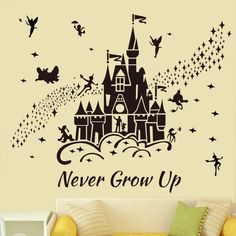 a wall decal with the words never grow up and a castle surrounded by stars