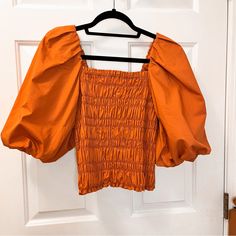 Never Worn Top, Beautiful Terracotta Color And The Fit Is Super Flexible Brand: Anthropologie X Mare Mare Condition: New With Tag (Actual Tag Came Off) Blouse Never Worn Size: Medium Fit: Stretchy Fit So Flexible Fit Let Me Know If You Have Any Questions :) Trendy Orange Spring Blouse, Trendy Orange Blouse For Spring, Fitted Orange Tops, Chic Orange Cotton Blouse, Fitted Orange Blouse For Spring, Chic Orange Blouse For Spring, Chic Orange Top For Brunch, Chic Orange Blouse For Brunch, Orange Tops For Fall Day Out