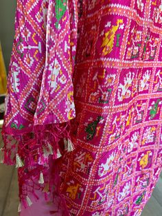 Lovely patola printed, full size dupattas in crepe silk material. The dupattas comes with tassels at the ends. Can be worn on Kurtis, gowns and lehengas. The dupattas are crushed and can be draped easily. Comes in 4 designs. Festive Chanderi Kurta With Tassels, Traditional Drape Kurta With Tassels For Festivals, Festival Kurta With Tassels In Traditional Drape, Festival Kurta With Tassels And Traditional Drape, Festive Multicolor Kurta With Tassels, Bollywood Style Salwar Kameez With Tassels For Navratri, Festival Kurta With Tassels, Traditional Multicolor Kurta With Tassels, Multicolor Straight Kurta With Tassels