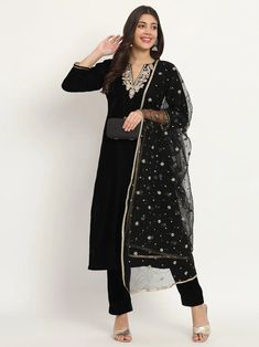 This elegant black velvet set exudes luxury and sophistication. It features intricate hand embroidery and Zardozi work, elevating your look with opulence. Its net dupatta further enhances the royal air of the set, showcasing the artistry of Indian craftsmanship. No. of pieces - 3 piece set. Color - Black. Fabric - Velvet and Net. Kurta Length - 46 inches. Washing Instructions - Dry Clean. Zardozi Work, Velvet Set, Palazzo Suit, Net Dupatta, Womens Size Chart, Black Friday Sale, Washing Instructions, Black Fabric, Black Velvet