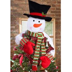 a christmas tree with a snowman decoration on it and an ebay gift card