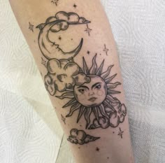 a sun and moon tattoo on the leg