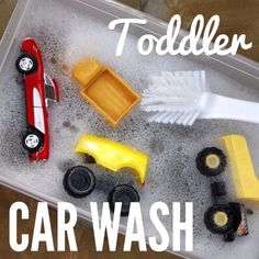 a plastic container filled with toy cars and dust