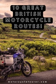 a motorcycle parked on the side of a road with grass and hills in the background