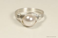 Sterling Silver White Pearl Ring Handmade by Jessica Luu Jewelry ~ Classic ~ Timeless ~ Bespoke ~ Have this elegant pearl ring made just for you in your choice of sterling silver or 14k gold filled wire. MATCHING ITEMS https://www.etsy.com/shop/JessicaLuuJewelry?search_query=white+pearl+wp MATERIALS: ~ 8mm white Swarovski pearl ~ Your choice of sterling silver or 14k gold filled wire HOW IT'S MADE: Each ring is handmade to order using U.S. standard jewelry sizing equipment to ensure the correct Silver Pearl Ring For Women, Everyday Adjustable White Pearl Ring, Adjustable Pearl White Ring, Minimalist Adjustable Silver Pearl Ring, Elegant White Wire Wrapped Pearl Ring, Classic Adjustable Pearl White Pearl Ring, Adjustable Wire Wrapped Round Pearl Ring, Pink Pearl Ring, Pearl Bangle Bracelet