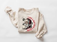 I Love a Man with a Beard Santa Christmas Sweatshirt, Funny Santa Beard Shirt, Cute Christmas for Women, Graphic Christmas Tee, Santa Xmas shirt Sizing and Color Information: Our shirts are custom-made just for you, so we cannot accept returns or exchanges. To get the best fit, please review our color and size charts before placing your order. If you have any questions about sizing or colors, feel free to contact us for clarification.  (If you need a 4XL T-Shirt, please let us know and we would Santa Beard, V Neck Shirts, Santa Sweatshirt, Mama Shirts, Sweatshirt Women, Sweatshirt Christmas, Holiday Sweater, Christmas Tees, Cute Christmas