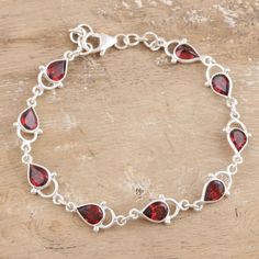 Exquisite red gems sparkle with vibrant color on a lovely link bracelet from Bhavesh. Faceted garnet teardrops in bezel settings align, linked by silver rings. A sterling clasp fastens the breathtaking bracelet. Red Gems, Fake Account, Silver Link Bracelet, Garnet Bracelet, Jewellery Ideas, Classy Jewelry, Hazel Eyes, Pretty Stuff, Garnet Rings