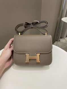 Hermes Constance 18Etoupe Epsom RGHWSize 18 x 14 x 5cmZ StampMar 2022New w SealIncludes full set box, dust bag and receiptPrice now 19,200 sgd 14,350 usd CN5474-01 Constance Hermes, Gg Outfits, Hermes Constance Bag, Hang Bags, Christmas Gifts For Wife, Hermes Constance, Into The Night, Dior Shoes, Louis Vuitton Shoes