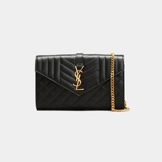 Saint Laurent wallet in matelassé grain de poudre embossed leather with metal YSL monogram detail. Detachable leather/chain crossbody strap; 19" drop Flap top with snap closure. Golden hardware Golden hardware Interior, center zip divides two compartments; 10 card slots, one bill compartment. Leather lining. Approx. 5.5"H x 8.8"W x 1.5"D. Approx. weight 1 lb. Made in Italy. Luxury Quilted Wallet On Chain For Evening, Classic Quilted Wallet On Chain For Evening, Classic Quilted Evening Wallet On Chain, Luxury Envelope Wallet On Chain With Strap, Ysl Wallet On Chain, Ysl Wallet, Wallet On Chain, Saint Laurent Wallet, Leather Chain