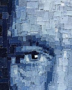 an abstract painting of a man's face with blue and white squares on it