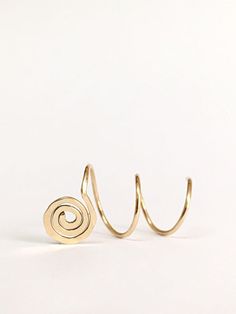 Gorgeous spiral threader earrings. Minimalist, comfortable, perfect for everyday use. The earrings are sold as single or as a pair of your choice and in 14K gold filled or sterling silver 925, see variations in drop-down menu. Measures: Each ear hoop is 9mm diameter. For different size, please contact us. How to use: 1. Adjust spiral width to much your piercings. 2. Insert the earring to first hole and then twist throw each hole. Made to order. Will arrive in a pretty gift box ready to give or k Metal Spiral Wrap Earrings, Spiral Metal Wrap Earrings, Metal Spiral Wrap Single Earring, Adjustable Spiral Ear Cuff, Adjustable Spiral Hoop Earrings, Spiral Cartilage Earrings As Gift, Hoop Earrings Piercing, Triple Piercing, Gold Threader Earrings