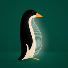 a black and white penguin sitting on top of a green floor next to a light