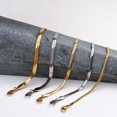 Our Snake Chain Bracelet is your perfect go-to accessory for everyday bracelet stacking support. With its flat lay design, it'll instantly add a touch of edge to your look! Materials: Gold stainless steel (No Tarnish) Flat snake chain Lobster claw clasp Measurements: 2mm width, 6" long with 2" extender 3mm width, 6" long with 2" extender 4mm width, 6" long with 2" extender 5mm width, 7" long with 2" extender Flat Snake Chain, Bracelet Stacking, Everyday Bracelet, Snake Chain Bracelets, Steel Jewelry, Everyday Jewelry, Stainless Steel Jewelry, Snake Chain, Jewelry Plate