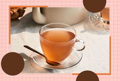 a cup of tea on a saucer with a spoon