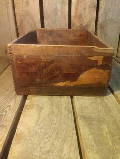 an old wooden crate with writing on it