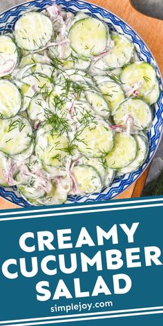 creamy cucumber salad in a blue bowl on a wooden cutting board with text overlay