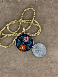 "Precious Metal Art Cloisonné Vintage 14 Karat Gold Pendant with 18 inch Vermeil Rope Chain a traditional Cloisonné Flowers with beautiful colors in this vintage pendant a gift to be Cherished 14 Karat Gold Cloisonne. This decorative flower pendant in which enamels are separated by strips of flattened 14 Karat gold wire placed edgeways on a 14 Karat yellow gold backing. Delicate Flowers with beautiful colors make this vintage pendant made by my friend David Kuo a fellow artist in the early 1980\ Yellow Gold Enamel Flower Pendant Jewelry, Traditional 14k Stamped Medallion Necklace, Traditional 14k Stamped Pendant Necklace, Traditional 14k Gold Round Pendant Necklace, Traditional Jewelry With Flower Charm And Shape, Traditional Jewelry With Flower Charm, Traditional 14k Stamped Necklaces, Traditional 14k Stamped Round Necklaces, Traditional Yellow Gold Flower Pendant Necklace