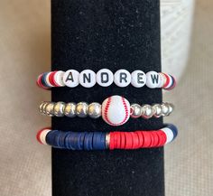 This GameDay baseball bracelet will score an accessory home run! *Choose a single, double stack, or triple stack bracelet to personalize and support your winning team! *Made with the strongest and best materials, including 6mm heishi beads and 6mm silver or light gold hematite beads. *Please include the following in your personalization: 1) your team name, athlete name(s), mascot, or slogan for the wording 2) your team colors for the heishi beads (see photos for options) 3) your choice of silver Customizable Adjustable Wristband For Sports Events, Customizable Adjustable Wristband For Sports, Sporty Customizable Adjustable Bracelet, Sporty Adjustable Bracelet Customizable, Sporty Adjustable Customizable Bracelets, Sporty Adjustable Customizable Bracelet, Customizable Adjustable Sports Bracelet, Personalized Sporty Wristband For Sports Events, Sporty Personalized Stretch Bracelet For Sports Events