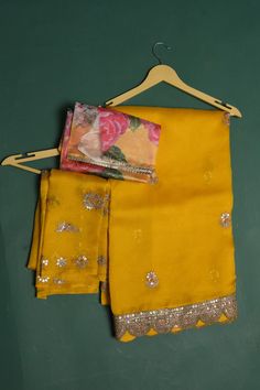 Be a vision of elegance at weddings and parties in this mango yellow embroidered organza sari. It comes with a matching and multicolor blouse piece. Shop designer sarees online in USA from Pure Elegance. DISCLAIMER:- The shown stitched blouse on the model is for display purpose only. The saree comes with a matching blouse piece and finished with fall and piko. Yellow Semi-stitched Chanderi Pre-draped Saree, Yellow Organza Pre-draped Saree For Party, Yellow Georgette Pre-draped Saree With Pallu, Yellow Organza Pre-draped Saree For Eid, Semi-stitched Yellow Blouse With Resham Embroidery, Yellow Resham Embroidery Blouse Piece For Diwali, Diwali Yellow Blouse Piece With Resham Embroidery, Embroidered Yellow Pre-draped Saree For Diwali, Yellow Embroidered Pre-draped Saree