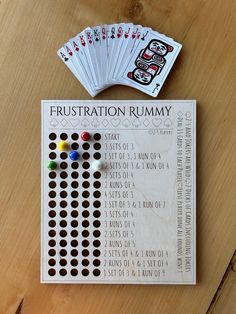 a wooden table topped with lots of cards