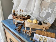 a table topped with lots of miniature items