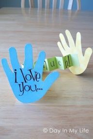 a hand made out of paper with the words i love you on it