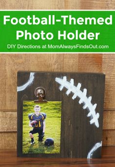 a wooden frame with a football on it and the words football - themed photo holder