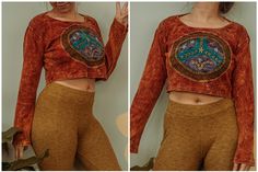 "Beautiful hand dyed rust long sleeve crop top with an embroidered peace sign. Comfortable cotton made in Nepal. Model is wearing size M Sizing details: S- pit to pit 18\", 13\" length M- pit to pit 19.5\", 14\" length L- pit to pit 21.5\", 16\" length XL- pit to pit 22\", 16.5\" length 2X- pit to pit 22.5\", 17\" length" Hippie Brown Long Sleeve Tops, Brown Long Sleeve Festival Top, Brown Long Sleeve Top For Festival, Brown Hippie Festival Tops, Bohemian Brown Cotton Crop Top, Casual Brown Crop Top For Festival, Hippie Long Sleeve Crop Top For Spring, Bohemian Crop Top For Fall Festivals, Fall Festival Bohemian Crop Top