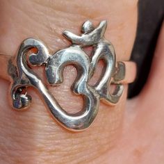 a close up of a person's silver ring