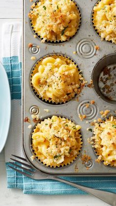 a muffin tin filled with baked macaroni and cheese cupcake batters