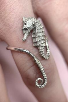 A silver cast sea horse accompanies you on all your journeys, gently coiling itself around your finger, evoking the beauty of the ocean in the most minute of details. Available in sterling silver and gold plate silver. Custom inquiries email info@stonehartjewelry.com Seahorse Jewelry, Horse Ring, Geode Necklace, Single Pearl Necklace, Light Weight Jewelry, Horse Jewelry, Sea Horse, Jewelry Lookbook, Star Studs