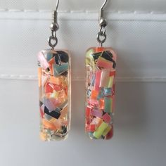 This is a beautiful pair of confetti earrings, made with resin. Very cute Shipping is registered I can combine shipping for multiple items Multicolor Glass Drop Earrings, Handmade Multicolor Resin Earrings, Multicolor Resin Earrings For Pierced Ears, Multicolor Resin Earrings, Playful Resin Dangle Earrings, Party Earrings In Multicolor Glass, Multicolor Resin Drop Earrings, Multicolor Glass Earrings For Party, Colorful Funky Earrings For Party