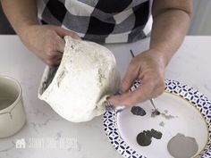 a person is making something on a plate