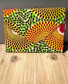 Our African Print Mid-Size Clutch purse is the perfect addition to your wardrobe. Made of authentic Ankara by artisans in Ghana, these clutches are truly one of a kind. Each one features a different fabric and flap closure that adds a little bit of elevated style to the look of your Ankara Clutch. Vegan Leather Backpack, Slouch Bags, Yoga Mat Bag, Elevated Style, Mat Bag, Mid Size, Pencil Pouch, Green And Yellow, Travel Pouch