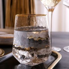 a close up of a wine glass on a tray