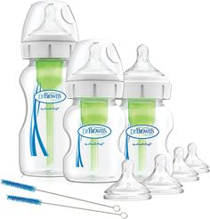 three bottles with straws in them and two empty ones next to each other on a white background